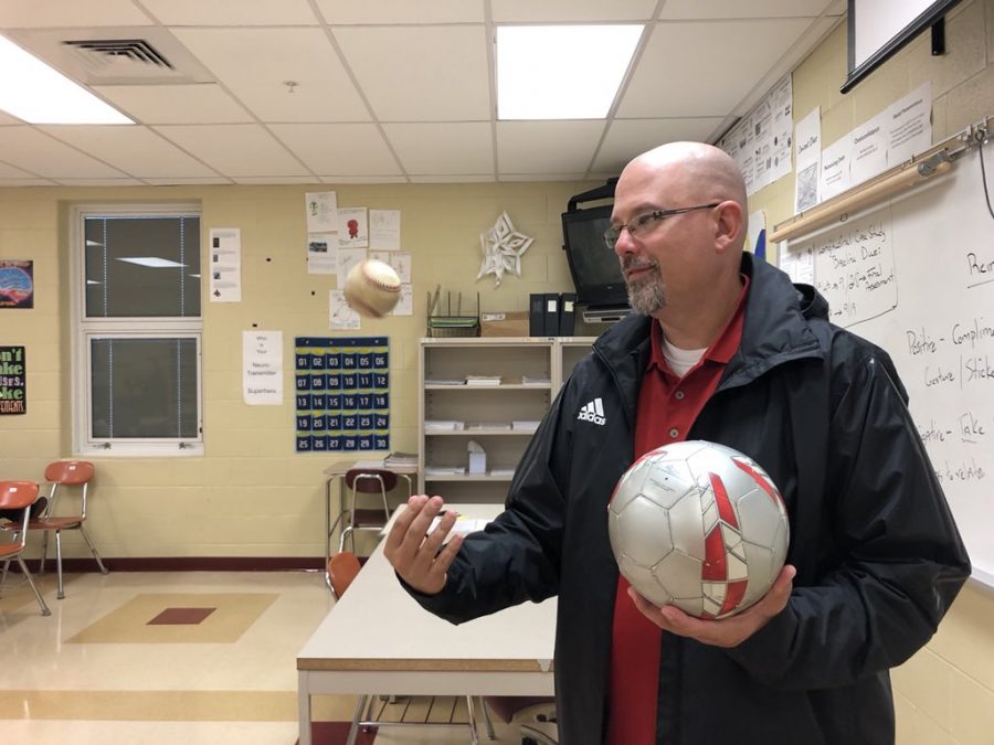 Canfield juggles a soccer and baseball. 