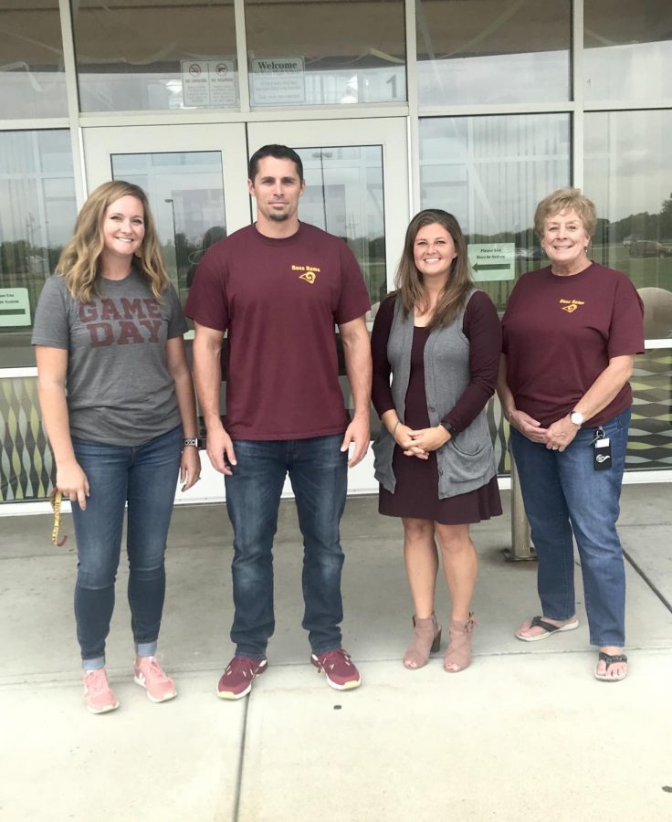 New RHS staff members pose in front of the building.