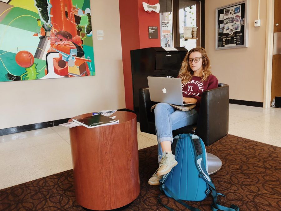 Ariel Williams, junior at Miami University, finishes homework at the Amos Music Library.