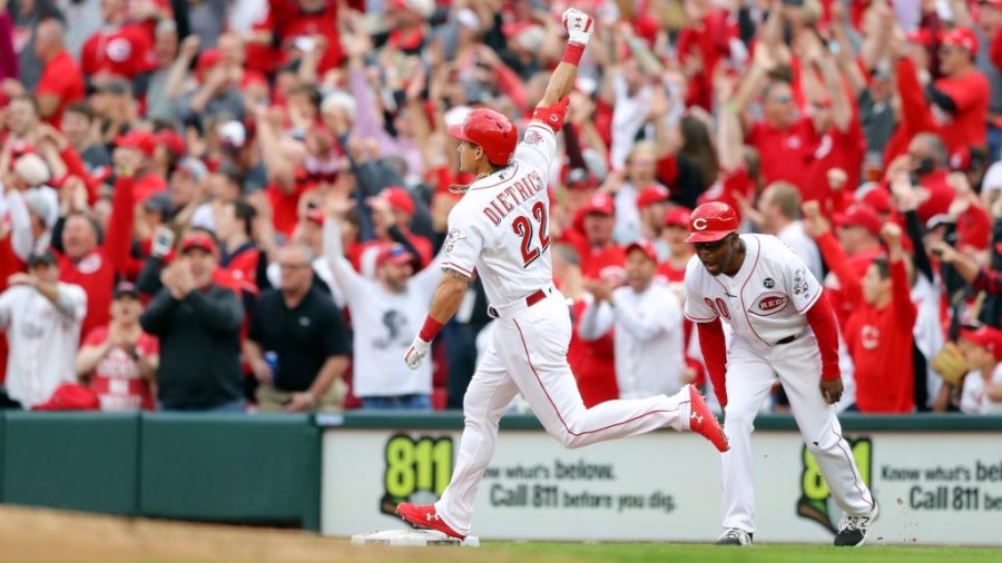 Derek Dietrich celebrates a go ahead 3 run home run on opening day against the Pittsburgh Pirates. 