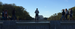 A man stands alone at the Reflecting Pool in Washington D.C..