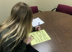 A student fills out their course option sheet
for the upcoming 2020-2021 school year.
