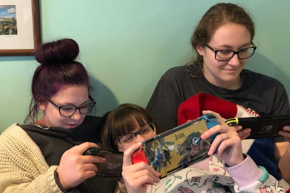 Three best friends (Carolyn Meyers, RHS graduate, Abbie Webster, junior, and Victoria Arno, junior) enjoy their Nintendo Switches 
while waiting for Animal Crossing: New Horizons to release.