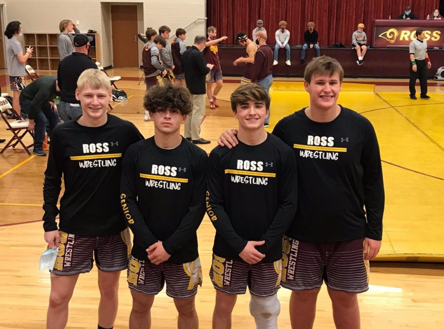 RHS senior wrestlers on senior night after a match against Carroll and Xenia: Ethan Boyle, Sean Beltran, Ben Breaker, and Griffin Peacock (left to right)
