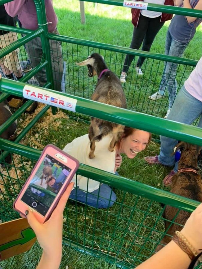 Ms. Mitchell interacting with some goats at Ross FFA Food for America day in May of 2019.