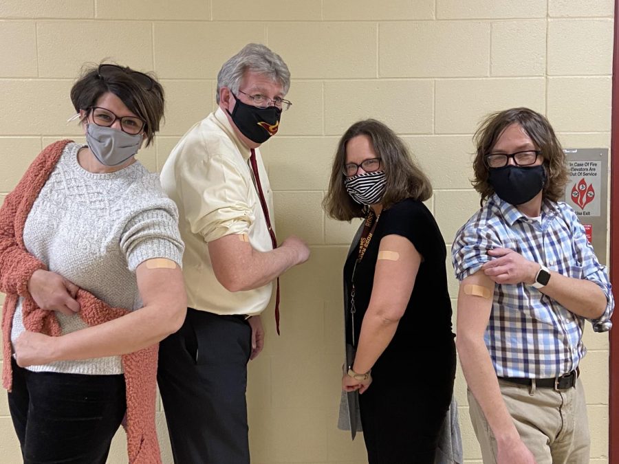 RHS faculty show off their bandaids after receiving their first dose of the COVID-19 vaccine. 