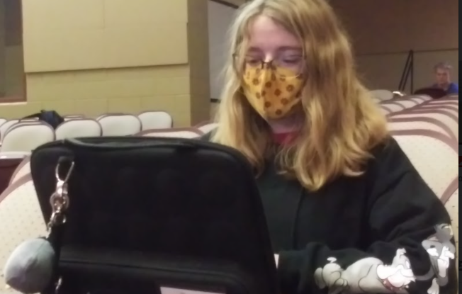 Becky Young, senior, watches a movie on her chromebook during a free period.