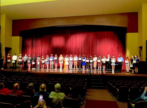 All inducted Tri-M members lined up with their certificates