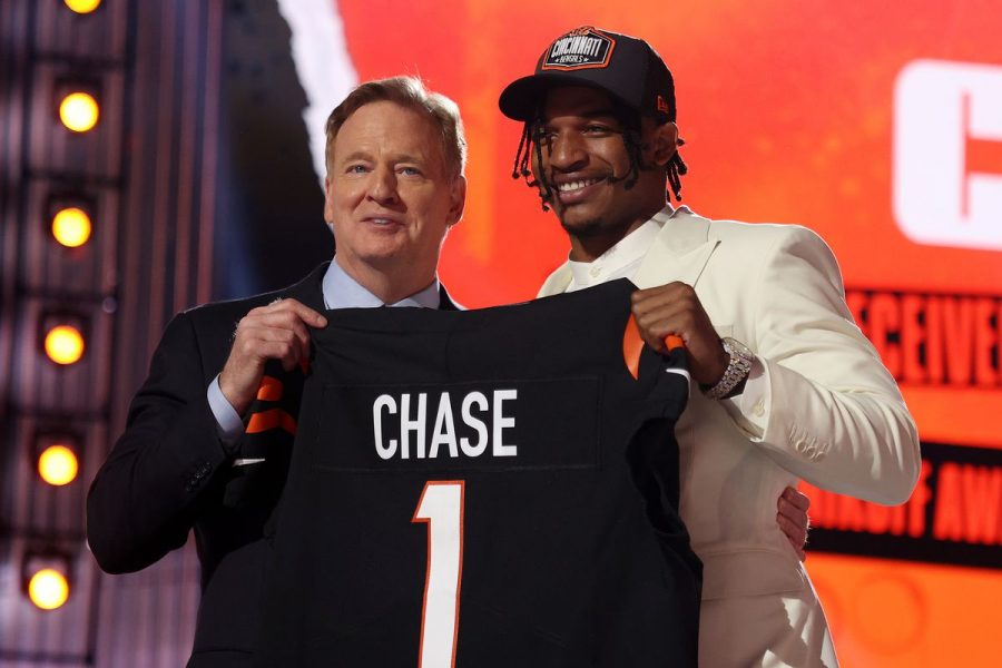 Wide receiver JaMarr Chase holds his new jersey after being drafted fifth in the 2021 NFL draft. 