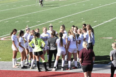 Head Girls Soccer Coach Jessica Buehner giving a pre-game speech before the Princeton game. 