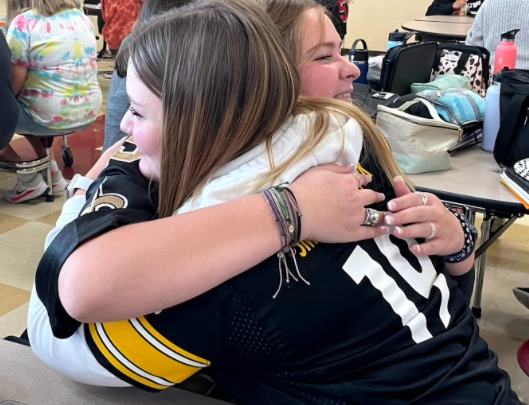 Taylor Willsey and Lydia Trout hugging it out after discussing their feelings and choosing to forgive one another.