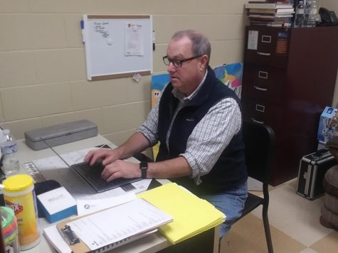 Staff member, Shawn Maus, sorting out some work emails on his laptop.