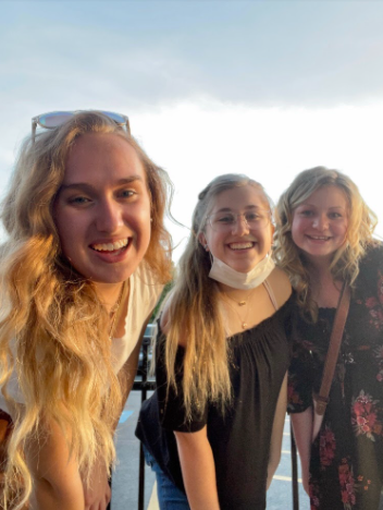 In May of 2021, Alyssa Bruening stands with friends Lexie Gibbons and Payton Jones, trying to be happy despite her struggles. 