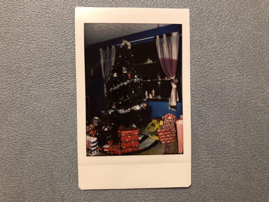 A Polaroid picture of gifts under a tree on Christmas. 
