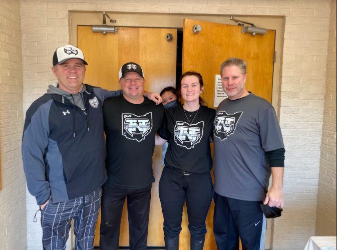 Gracie Elliott standing with her select softball coaches Kris Tegeder, Kavin Morgan, and Kevin Smith(left to right, not picture Jeff Michael). 

