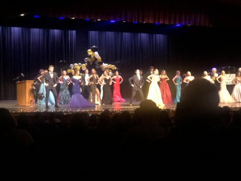 Students put their stunning dresses and suits on display during a group dance at the prom fashion show.