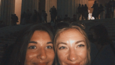 Natalie Janssen with her sister Emily Janssen posing for a selfie in front of the Lincoln Memorial in Washington, DC in November 2021. 
