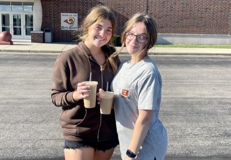 Seniors Chelsey Hair and Hannah Cupp adhere to the new dress code while posing outside of the Ross High School event entrance.