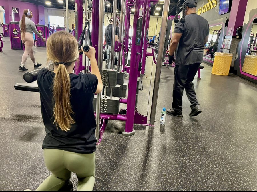 Sophomore Callie Jones utilizes a weight machine at Planet Fitness in Colerain, OH.