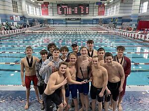 The Ross boys swim team holds the SWOC championship trophy for the first time in history Saturday Jan. 28th 2023. 