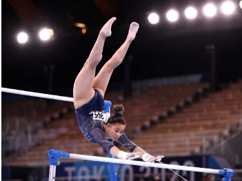 Gymnast Sunisa Lee Does her bar routine at the 2020 Tokyo Olympics.
