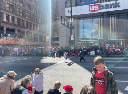 Onlookers wait for the parade to start.