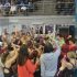 The RHS swim team breaks into a cheer before the meet.